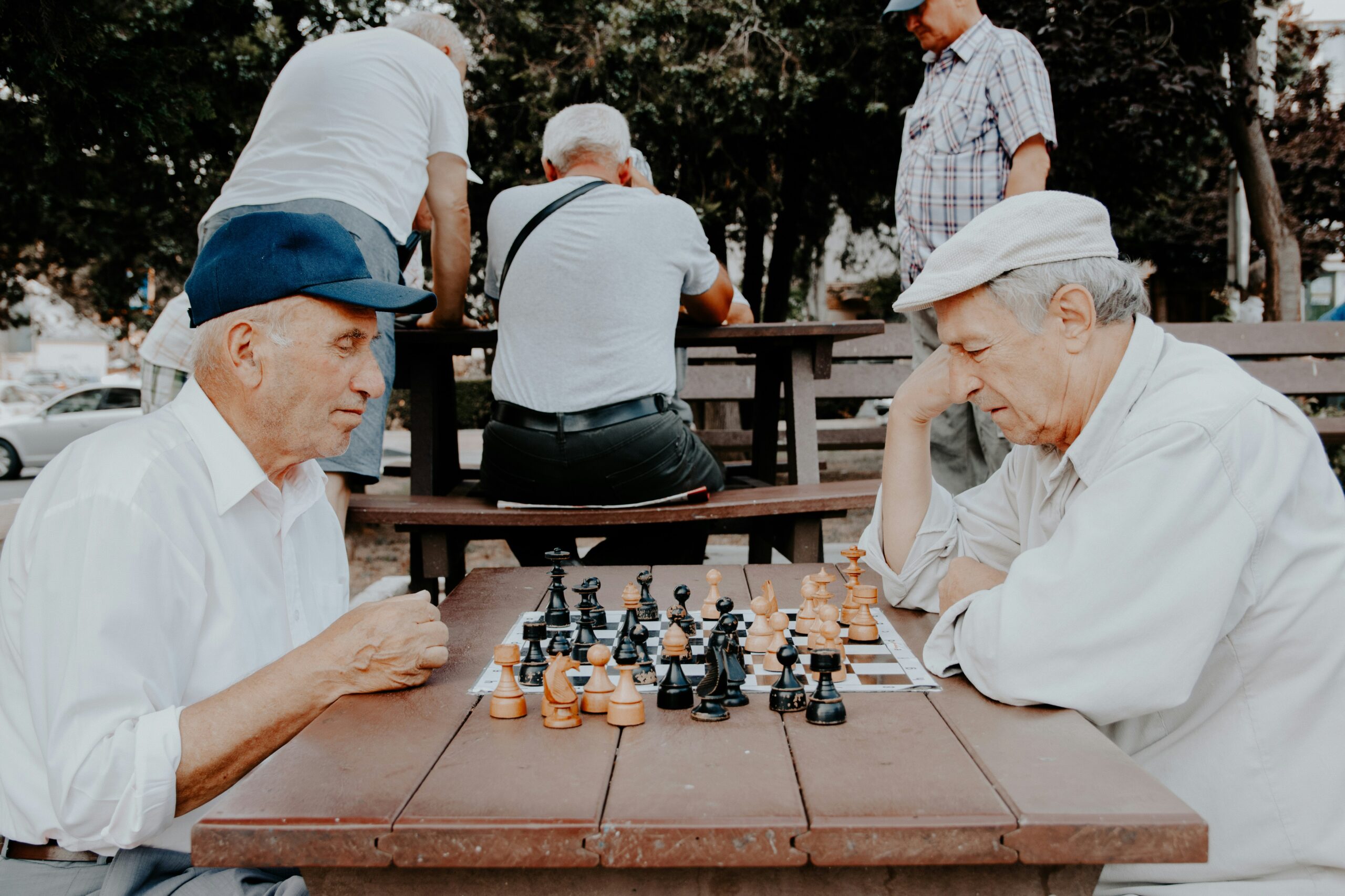 two older gentlemen playing chess
